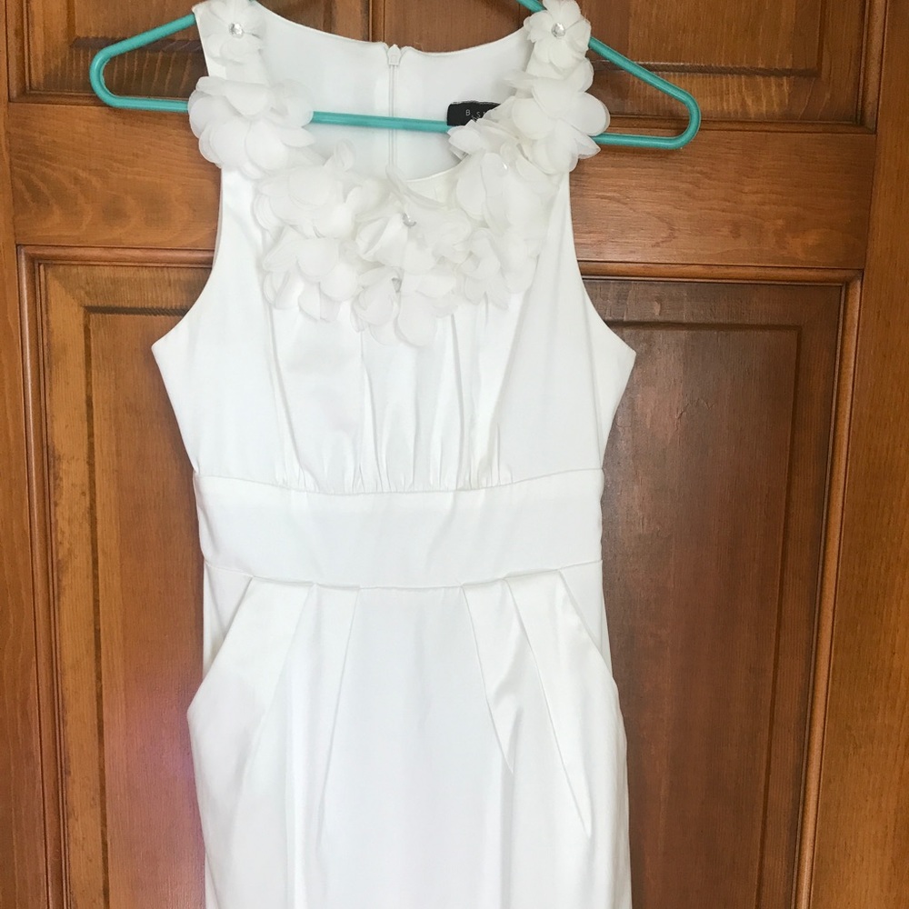 Beautiful gently used white b. Smart dress.